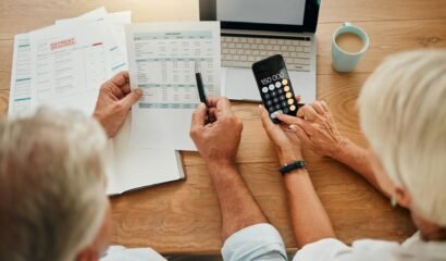 Home budget, finance planning and senior couple calculating their expenses, bills or income during